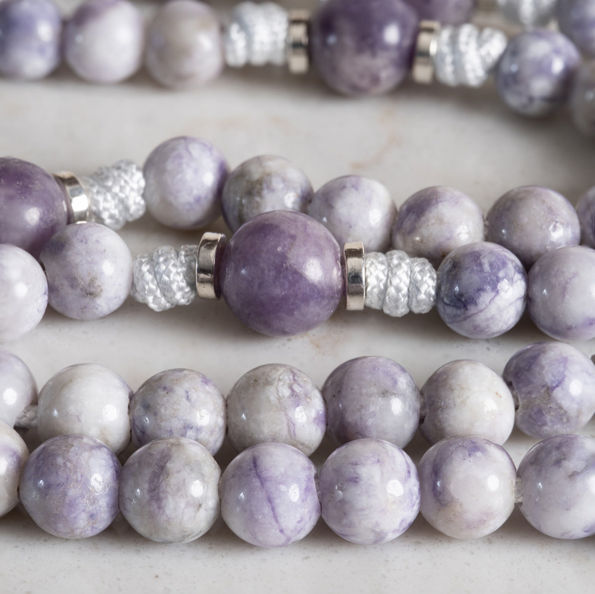 Close-up of Tiffany Jasper and Lepidolite beads on the Queen of Heaven Classic rosary
