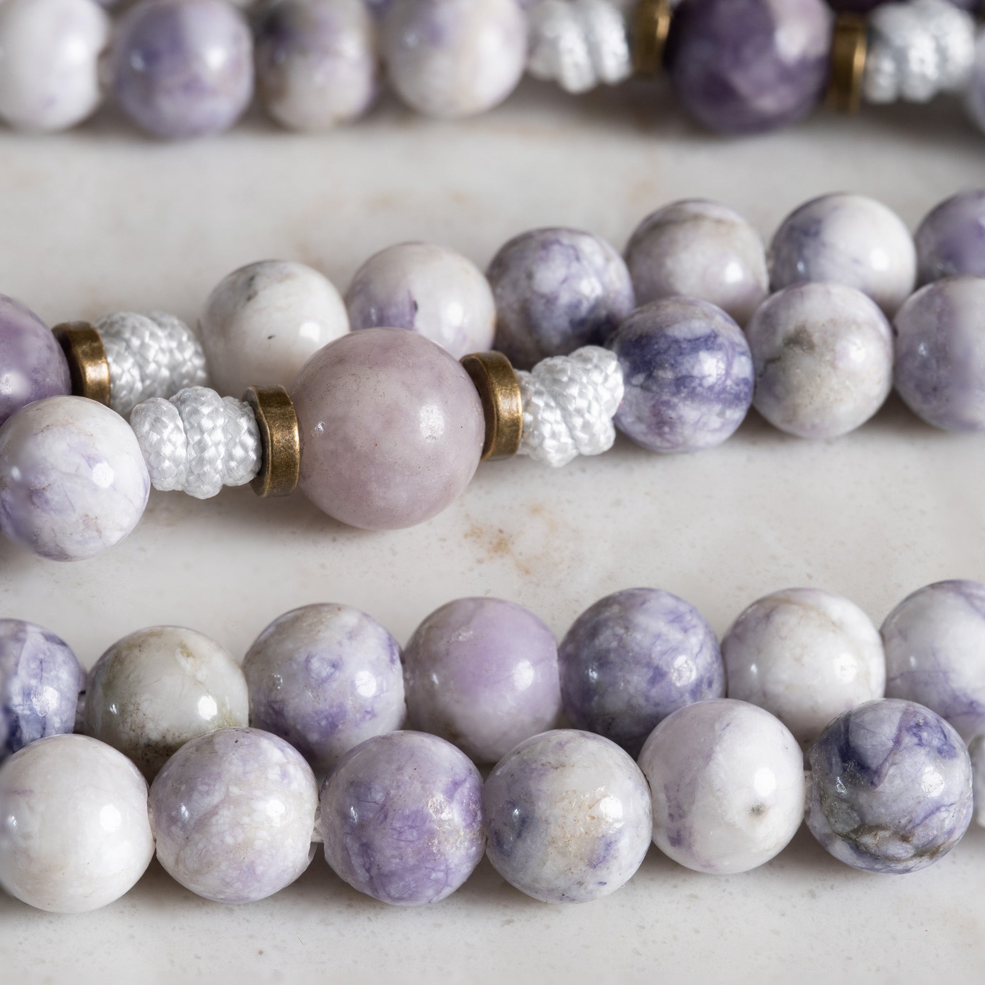 Close-up of Tiffany Jasper and Lepidolite beads on the Queen of Heaven Heirloom rosary