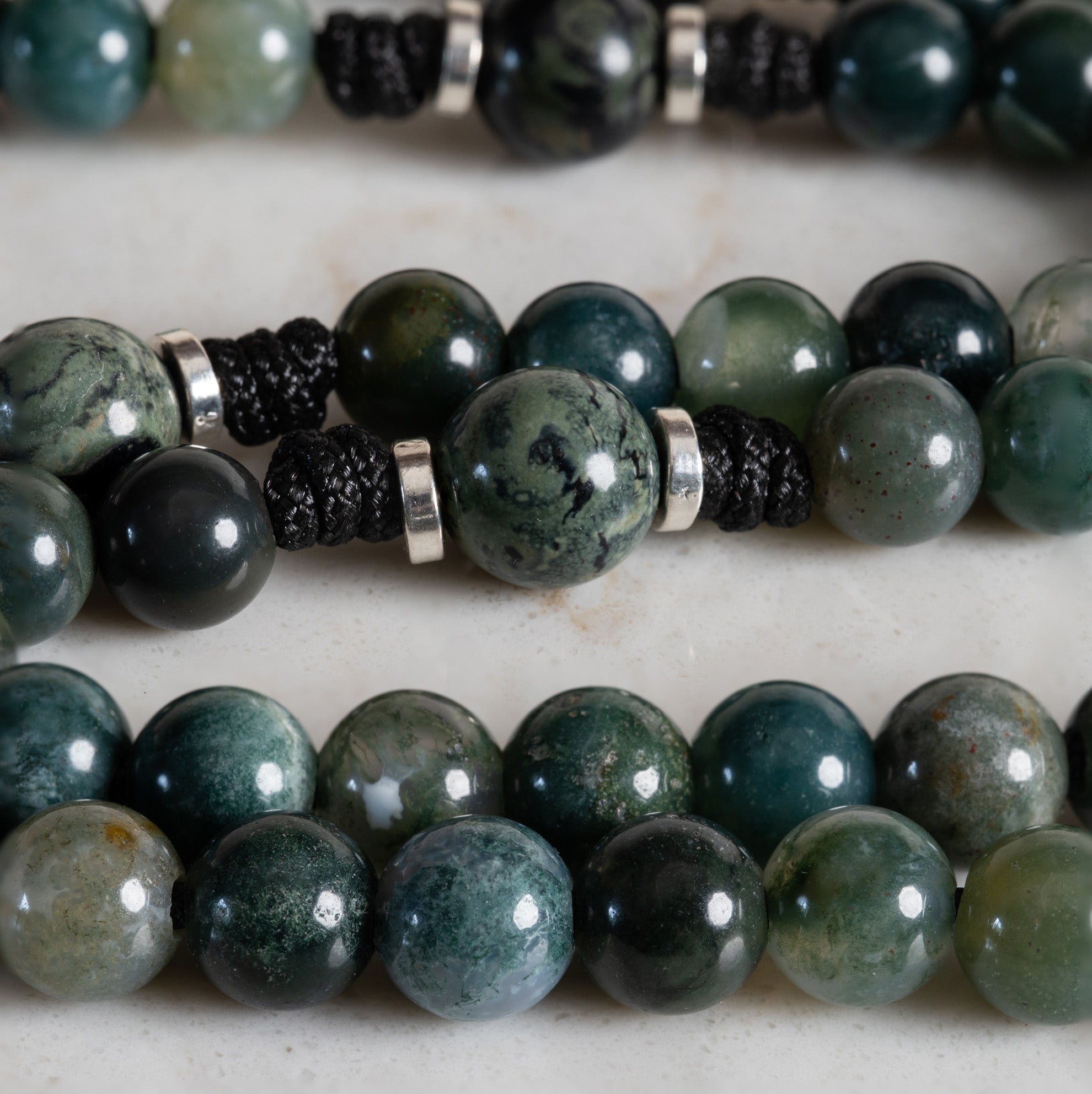 Close-up of Moss Agate and Kambaba Jasper beads on the Seat of Wisdom rosary
